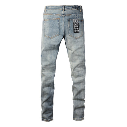 Retro Inspired Light Blue Jeans with Distressed Wash and White Logo 3029
