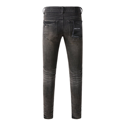 Chic Black Distressed Denim Pants 9080 Combining Rips and Patches for a Modern Style