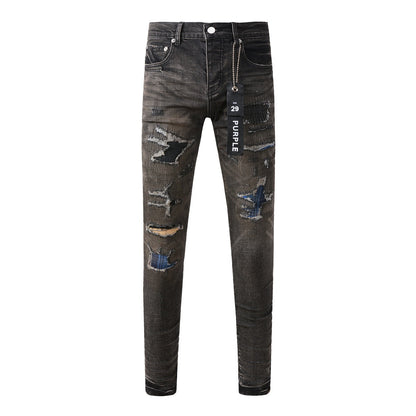 Pantalon en denim noir chic et vieilli 9080 combinant déchirures et patchs pour un style moderne 